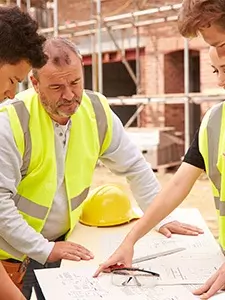 contractors discussing over working drawings